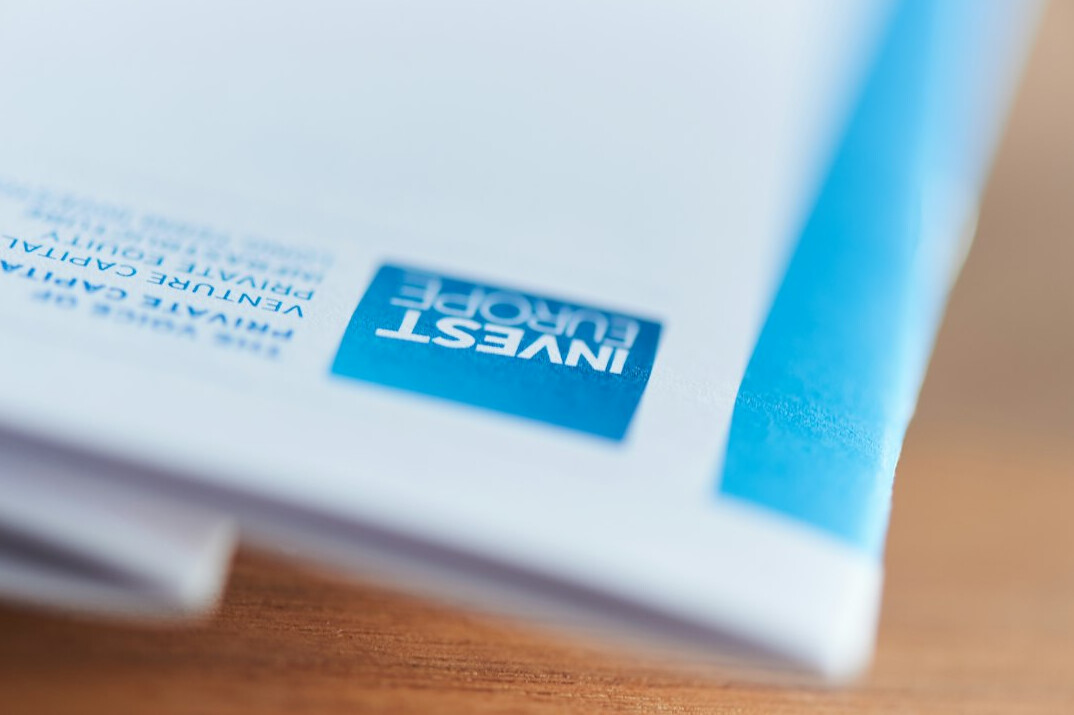Financial documents and reports spread on a desk for research